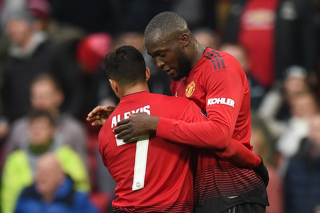 Manchester United's Belgian striker Romelu Lukaku (R) celebrates scoring their second goal during the English FA Cup third round football match between Manchester United and Reading at Old Trafford in Manchester, north west England, on January 5, 2019. (Photo by Oli SCARFF / AFP) / RESTRICTED TO EDITORIAL USE. No use with unauthorized audio, video, data, fixture lists, club/league logos or 'live' services. Online in-match use limited to 120 images. An additional 40 images may be used in extra time. No video emulation. Social media in-match use limited to 120 images. An additional 40 images may be used in extra time. No use in betting publications, games or single club/league/player publications. /         (Photo credit should read OLI SCARFF/AFP/Getty Images)