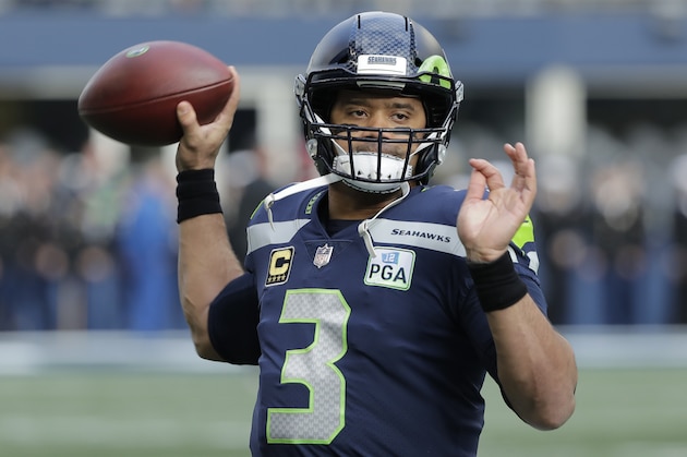 Seattle Seahawks quarterback Russell Wilson warms up before an NFL football game against the Arizona Cardinals, Sunday, Dec. 30, 2018, in Seattle. (AP Photo/Ted S. Warren)
