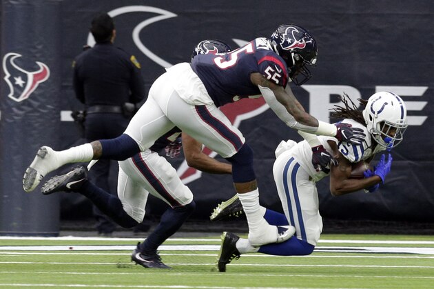Indianapolis Colts wide receiver T.Y. Hilton (13) pulls in a catch in front of Houston Texans inside linebacker Benardrick McKinney (55) during the first half of an NFL wild card playoff football game, Saturday, Jan. 5, 2019, in Houston. (AP Photo/Michael Wyke)