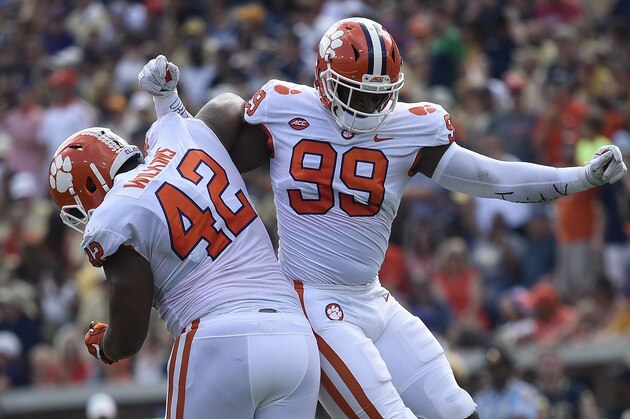 Clemson defensive end Clelin Ferrell (99) and Clemson defensive lineman Christian Wilkins (42) celebrate a tackle against Georgia Tech during the first half of an NCAA college football game, Saturday, Sept. 22, 2018, in Atlanta. (AP Photo/Jon Barash)