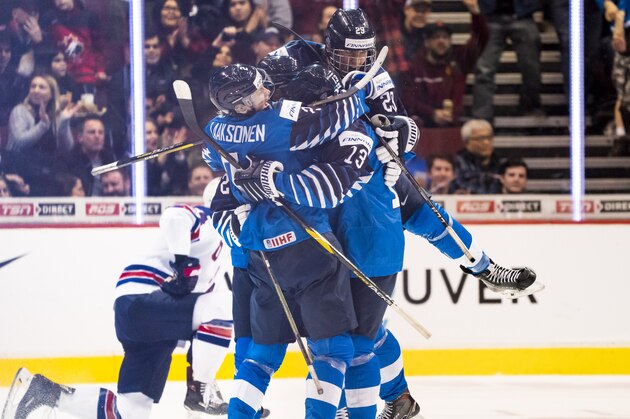 VANCOUVER, BC - JANUARY 5: Oskari Laaksonen #2, Valtteri Puustinen #13 and Anton Lundell #29 of Finland celebrates with goal scorer Jesse Ylonen #27 of Finland (not pictured) taking a 1-0 lead over the United States in Gold Medal hockey action of the 2019 IIHF World Junior Championship on January, 5, 2019 at Rogers Arena in Vancouver, British Columbia, Canada.  (Photo by Rich Lam/Getty Images)