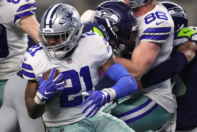 ARLINGTON, TEXAS - JANUARY 05: Ezekiel Elliott #21 of the Dallas Cowboys carries the ball in the third quarter against the Seattle Seahawks during the Wild Card Round at AT&T Stadium on January 05, 2019 in Arlington, Texas. (Photo by Tom Pennington/Getty Images)