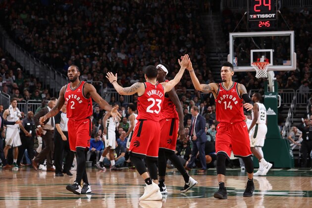 MILWAUKEE, WI - JANUARY 5:  Fred VanVleet #23 of the Toronto Raptors hi fives teammates during the game against the Milwaukee Bucks on January 5, 2019 at the Fiserv Forum Center in Milwaukee, Wisconsin. NOTE TO USER: User expressly acknowledges and agrees that, by downloading and or using this Photograph, user is consenting to the terms and conditions of the Getty Images License Agreement. Mandatory Copyright Notice: Copyright 2019 NBAE (Photo by Gary Dineen/NBAE via Getty Images).