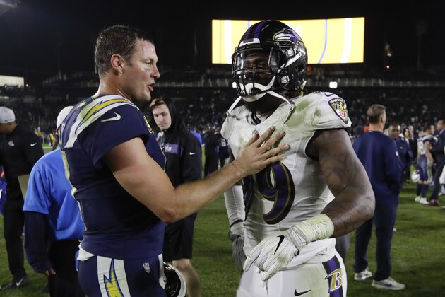 Los Angeles Chargers quarterback Philip Rivers, left, and Baltimore Ravens outside linebacker Matt Judon argue after an NFL football game Saturday, Dec. 22, 2018, in Carson, Calif. (AP Photo/Marcio Jose Sanchez)
