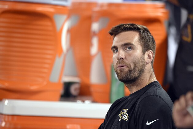 FILE - In this Thursday, Aug. 11, 2016, file photo, Baltimore Ravens quarterback Joe Flacco sits on the bench during the first half of an NFL preseason football game against the Carolina Panthers in Baltimore. Flacco is seeking to return from a season-ending injury in November that snapped his run of 137 consecutive starts. It was one of many injuries that contributed heavily to a dismal 5-11 finish for the Ravens, their first losing season under coach John Harbaugh. (AP Photo/Nick Wass, File)