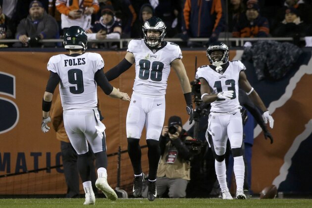 Philadelphia Eagles tight end Dallas Goedert (88) celebrates a touchdown with quarterback Nick Foles (9) during the second half of an NFL wild-card playoff football game against the Chicago Bears Sunday, Jan. 6, 2019, in Chicago. (AP Photo/David Banks)