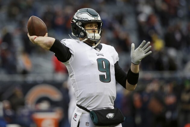 Philadelphia Eagles quarterback Nick Foles (9) warms up before an NFL wild-card playoff football game against the Chicago Bears Sunday, Jan. 6, 2019, in Chicago. (AP Photo/David Banks)