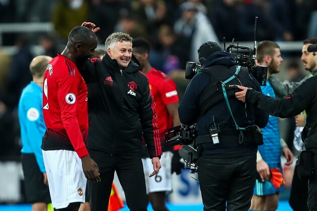 NEWCASTLE UPON TYNE, ENGLAND - JANUARY 02: Ole Gunnar Solskjaer the interim head coach / manager of Manchester United celebrates with Romelu Lukaku of Manchester United at full time during the Premier League match between Newcastle United and Manchester United at St. James Park on January 2, 2019 in Newcastle upon Tyne, United Kingdom. (Photo by Robbie Jay Barratt - AMA/Getty Images)