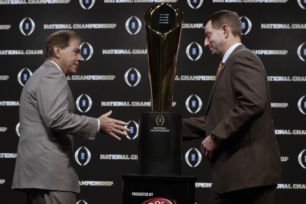 Alabama head coach Nick Saban and Clemson head coach Dabo Swinney pose with the trophy at a news conference for the NCAA college football playoff championship game Sunday, Jan. 6, 2019, in Santa Clara, Calif. (AP Photo/David J. Phillip) Alabama head coach Nick Saban and Clemson head coach Dabo Swinney pose with the trophy at a news conference for the NCAA college football playoff championship game Sunday, Jan. 6, 2019, in Santa Clara, Calif. (AP Photo/David J. Phillip)