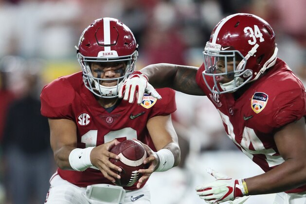 MIAMI, FL - DECEMBER 29: Tua Tagovailoa #13 of the Alabama Crimson Tide hands it off to Damien Harris #34 of the Alabama Crimson Tide in the third quarter during the College Football Playoff Semifinal against the Oklahoma Sooners at the Capital One Orange Bowl at Hard Rock Stadium on December 29, 2018 in Miami, Florida.  (Photo by Jamie Squire/Getty Images)