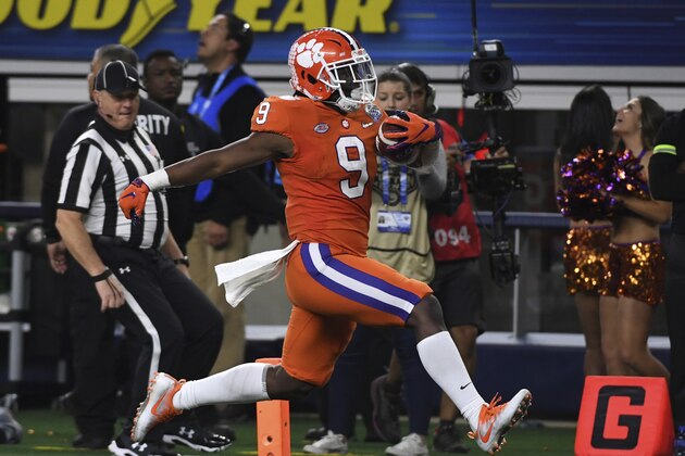 Clemson running back Travis Etienne (9) sprints into the end zone for a touchdown in the second half of the NCAA Cotton Bowl semi-final playoff football game against Notre Dame on Saturday, Dec. 29, 2018, in Arlington, Texas. (AP Photo/Jeffrey McWhorter)