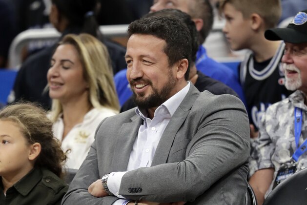 Former Orlando Magic player Hedo Turkoglu watches the first half of an NBA basketball game between the Orlando Magic and the Sacramento Kings, Tuesday, Oct. 30, 2018, in Orlando, Fla. (AP Photo/John Raoux)