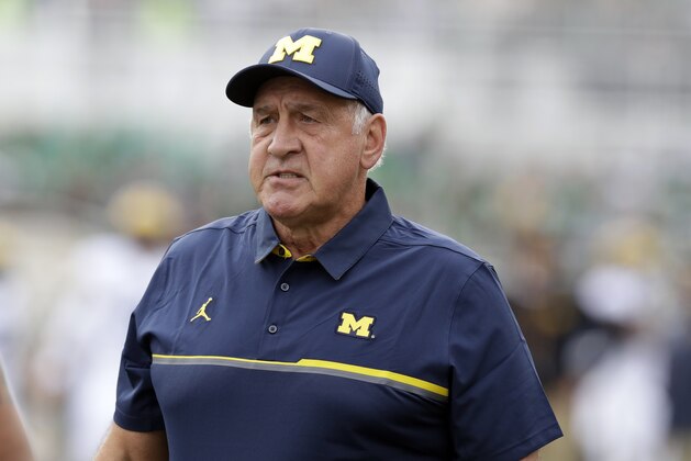 Michigan defensive line coach Greg Mattison watches during warmups of a college football game against Michigan State, Saturday, Oct. 29, 2016, in East Lansing, Mich. (AP Photo/Carlos Osorio)