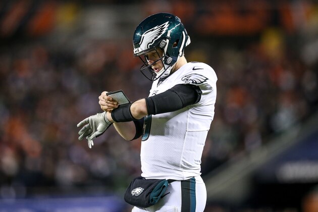 CHICAGO, ILLINOIS - JANUARY 06:  Nick Foles #9 of the Philadelphia Eagles checks his play card in the fourth quarter of the NFC Wild Card Playoff game against the Chicago Bears at Soldier Field on January 06, 2019 in Chicago, Illinois. (Photo by Dylan Buell/Getty Images)