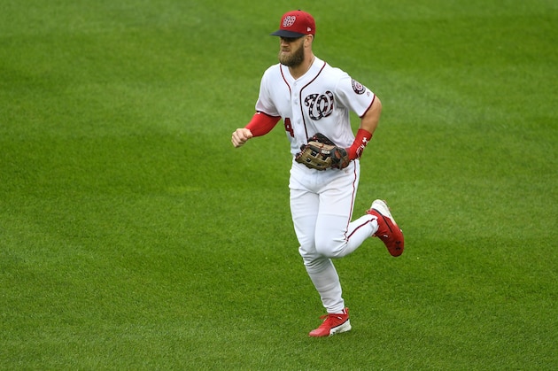 WASHINGTON, DC - SEPTEMBER 23:  Bryce Harper #34 of the Washington Nationals runs in from the outfield during the game against the New York Mets at Nationals Park on September 23, 2018 in Washington, DC.  (Photo by G Fiume/Getty Images)