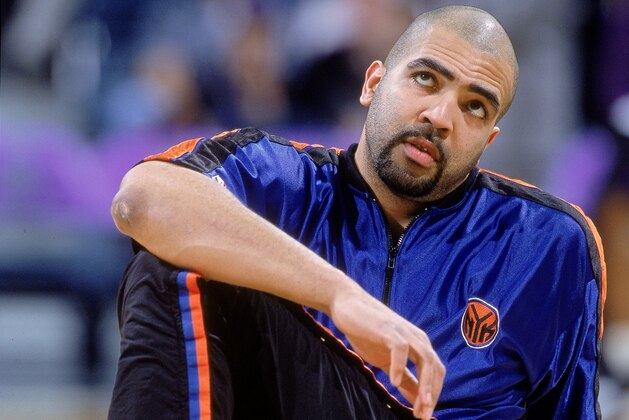 23 Jan 2001:  Felton Spencer #50 of the New York Knicks stretches out on the court before the game against the Milwaukee Bucks at the Bradley Center in Milwaukee, Wisconsin. The Bucks won 105-91. NOTE TO USER: It is expressly understood that the only rights Allsport are offering to license in this Photograph are one-time, non-exclusive editorial rights. No advertising or commercial uses of any kind may be made of Allsport photos. User acknowledges that it is aware that Allsport is an editorial sports agency and that NO RELEASES OF ANY TYPE ARE OBTAINED from the subjects contained in the photographs.Mandatory Credit: Jonathan Daniel/Allsport