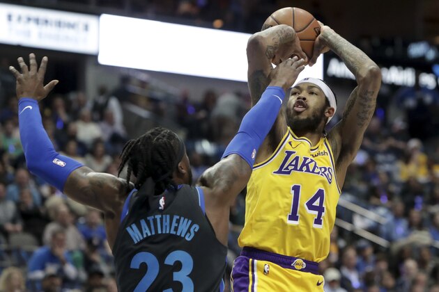 Los Angeles Lakers forward Brandon Ingram (14) shoots against Dallas Mavericks guard Wesley Matthews (23) during the first quarter of an NBA basketball game in Dallas, Monday, Jan. 7, 2019. (AP Photo/LM Otero)