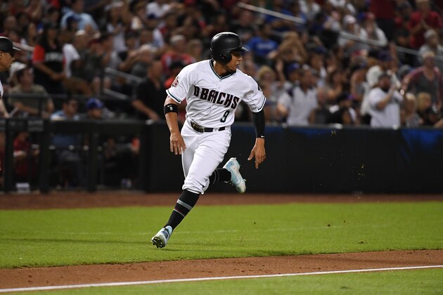 PHOENIX, AZ - SEPTEMBER 25:  Jon Jay #9 of the Arizona Diamondbacks rounds third base while keeping his eye on the ball against the Los Angeles Dodgers at Chase Field on September 25, 2018 in Phoenix, Arizona.  (Photo by Norm Hall/Getty Images)