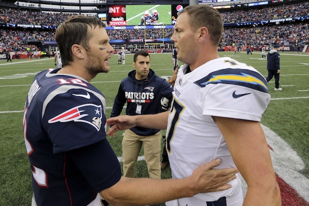 New England Patriots quarterback Tom Brady (12) andLos Angeles Chargers quarterback Philip Rivers (17) speak at midfield after an NFL football game, Sunday, Oct. 29, 2017, in Foxborough, Mass. (AP Photo/Steven Senne)