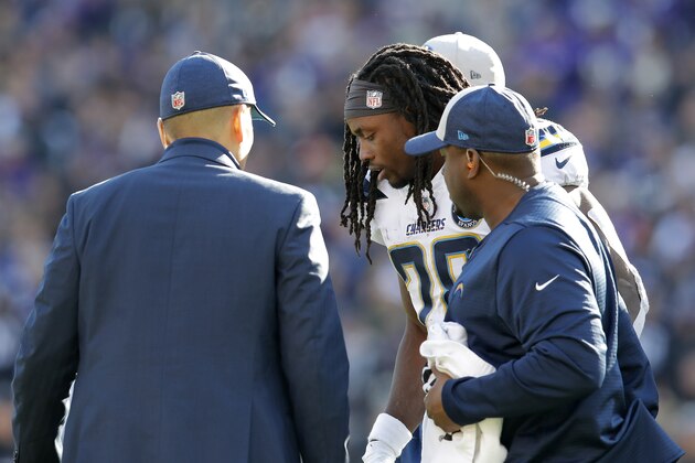 Los Angeles Chargers running back Melvin Gordon (28) is assisted off the field after a play in the first half of an NFL wild card playoff football game against the Baltimore Ravens, Sunday, Jan. 6, 2019, in Baltimore. (AP Photo/Carolyn Kaster)