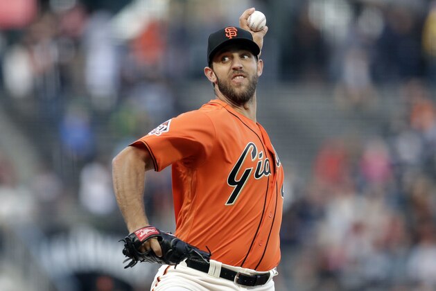 San Francisco Giants starting pitcher Madison Bumgarner throws to an Oakland Athletics during the first inning of a baseball game Friday, July 13, 2018, in San Francisco. (AP Photo/Marcio Jose Sanchez)