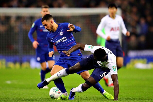 LONDON, ENGLAND - JANUARY 08: Eden Hazard of Chelsea is tackled by Davinson Sanchez of Tottenham Hotspur during the Carabao Cup Semi Final First Leg between Tottenham Hotspur and Chelsea at Wembley Stadium on January 08, 2019 in London, England. (Photo by Chris Brunskill/Fantasista/Getty Images)