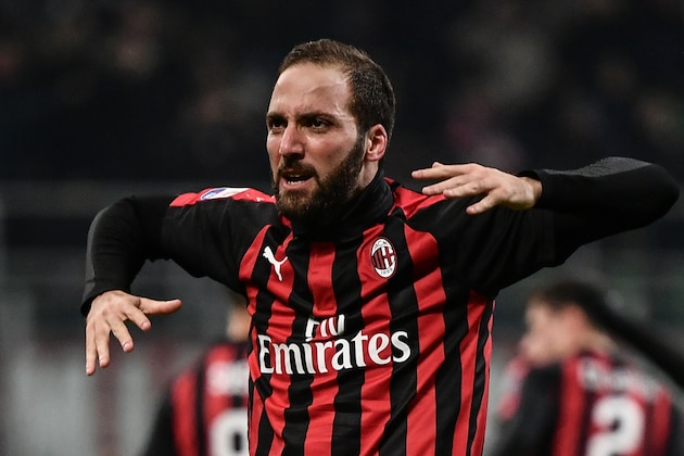 AC Milan's Argentine forward Gonzalo Higuain celebrates after scoring 2-1 during the Italian Serie A football match AC Milan vs Spal on December 29, 2018 at San Siro stadium in Milan. (Photo by Marco BERTORELLO / AFP)        (Photo credit should read MARCO BERTORELLO/AFP/Getty Images)