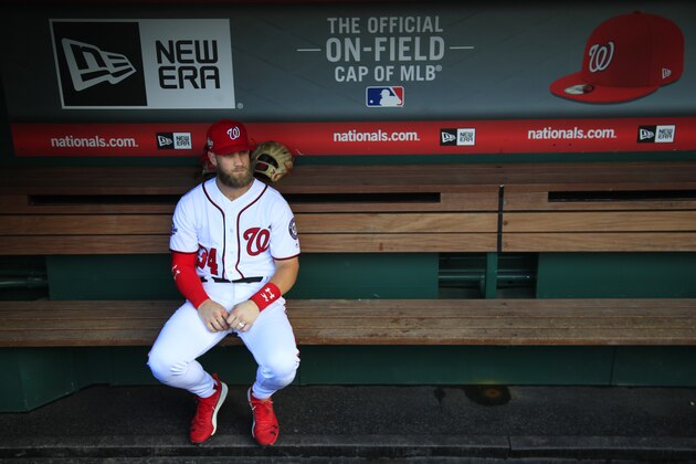 Washington Nationals Bryce Harper, looks at the baseball field from their dug out before the start of the Nationals last home game of the season against the Miami Marlins in Washington, Wednesday, Sept. 26, 2018. (AP Photo/Manuel Balce Ceneta)