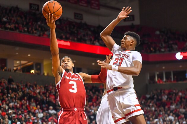 LUBBOCK, TX - JANUARY 08: Miles Reynolds #3 of the Oklahoma Sooners goes in for a lay up against Jarrett Culver #23 of the Texas Tech Red Raiders during the first half of the game on January 8, 2019 at United Supermarkets Arena in Lubbock, Texas. (Photo by John Weast/Getty Images)