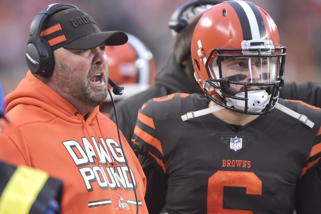 Cleveland Browns offensive coordinator Freddie Kitchens, left, talks with quarterback Baker Mayfield (6) in the fourth quarter of an NFL football game against the Cincinnati Bengals, Sunday, Dec. 23, 2018, in Cleveland. The Browns won 28-16. (AP Photo/David Richard)