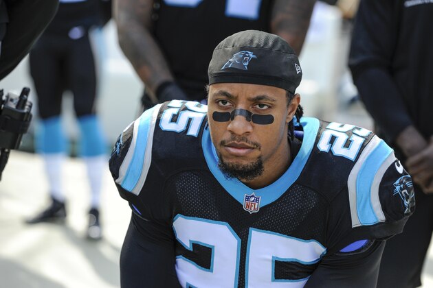 FILE - In this Nov. 25, 2018, file photo, Carolina Panthers strong safety Eric Reid (25) knells along the sideline during the national aAnthem before the start of an NFL football game against the Seattle Seahawks in Charlotte, N.C. Reid says he is “not surprised” he has been drug tested by the NFL six times in the past 11 weeks, his Panthers teammates and coaches are growing increasingly annoyed at the frequency of the league’s “random” policy. (AP Photo/Mike McCarn, File)
