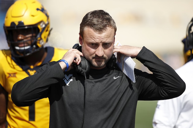 MORGANTOWN, WV - OCTOBER 06: Offensive coordinator Jake Spavital of the West Virginia Mountaineers looks on during the game against the Kansas Jayhawks at Mountaineer Field on October 6, 2018 in Morgantown, West Virginia. The Mountaineers won 38-22. (Photo by Joe Robbins/Getty Images)