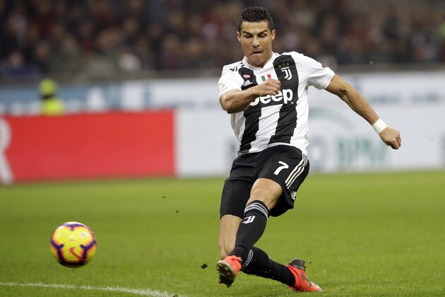 Juventus' Cristiano Ronaldo shoots the ball during a Serie A soccer match between AC Milan and Juventus, at Milan's San Siro stadium, Sunday, Nov. 11, 2018. (AP Photo/Luca Bruno)
