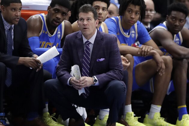 File-This Dec. 22, 2018, file photo shows UCLA head coach Steve Alford and his players watching during the second half of an NCAA college basketball game against Ohio State, in the fifth annual CBS Sports Classic, in Chicago.  Alford has been fired as UCLA basketball coach after six seasons, with the Bruins mired in a four-game skid that included losses at home to Belmont and Liberty. Athletic director Dan Guerrero said Monday, Dec. 31, 2018, that assistant Murry Bartow will serve as interim coach through the end of the season. (AP Photo/Nam Y. Huh, File)