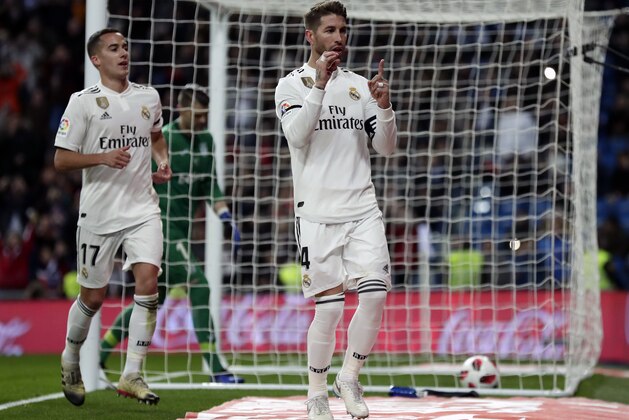 Real Madrid's Sergio Ramos, center, celebrates after scoring a penalty during a Spanish Copa del Rey soccer match between Real Madrid and Leganes at the Bernabeu stadium in Madrid, Spain, Wednesday, Jan. 9, 2019. (AP Photo/Manu Fernandez)