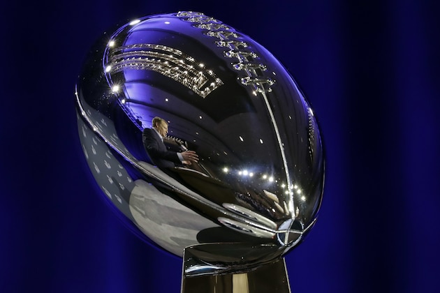 NFL Commissioner Roger Goodell is reflected in the Vince Lombardi Trophy as he speaks during a news conference in advance of the Super Bowl 52 football game, Wednesday, Jan. 31, 2018, in Minneapolis. The Philadelphia Eagles play the New England Patriots on Sunday, Feb. 4, 2018. (AP Photo/Matt Slocum)