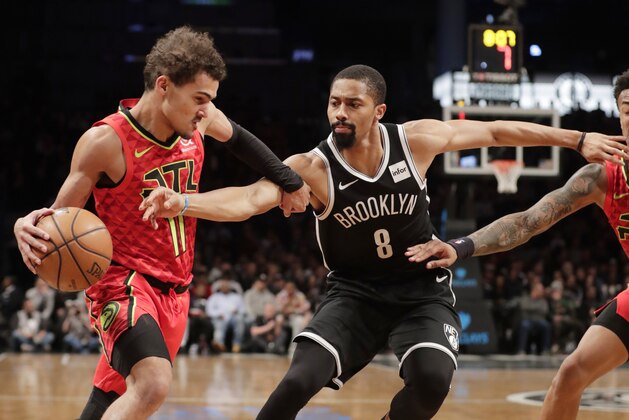Brooklyn Nets' Spencer Dinwiddie (8) defends against Atlanta Hawks' Trae Young (11) during the first half of an NBA basketball game Wednesday, Jan. 9, 2019, in New York. (AP Photo/Frank Franklin II)