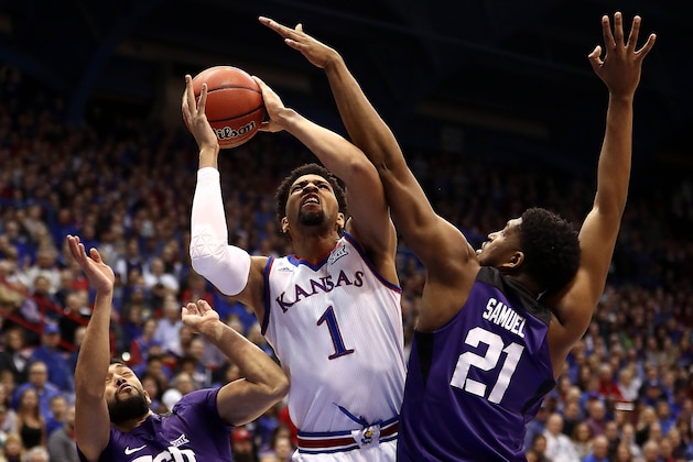 LAWRENCE, KANSAS - JANUARY 09:  Dedric Lawson #1 of the Kansas Jayhawks shoots as Kevin Samuel #21 and Alex Robinson #25 of the TCU Horned Frogs defend during the game at Allen Fieldhouse on January 09, 2019 in Lawrence, Kansas. (Photo by Jamie Squire/Getty Images)