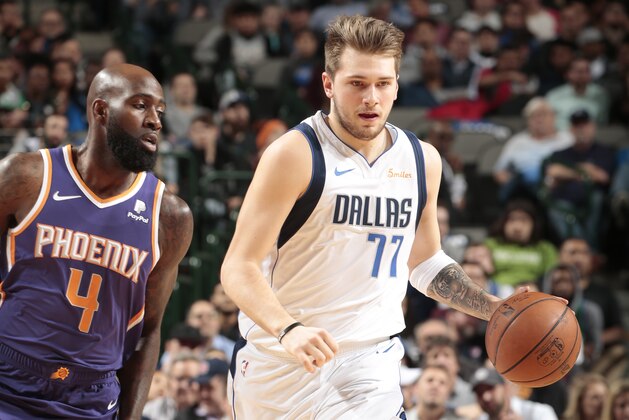 DALLAS, TX - JANUARY 9:  Luka Doncic #77 of the Dallas Mavericks handles the ball against the Phoenix Suns on January 9, 2019 at the American Airlines Center in Dallas, Texas. NOTE TO USER: User expressly acknowledges and agrees that, by downloading and or using this photograph, User is consenting to the terms and conditions of the Getty Images License Agreement. Mandatory Copyright Notice: Copyright 2019 NBAE (Photo by Glenn James/NBAE via Getty Images)