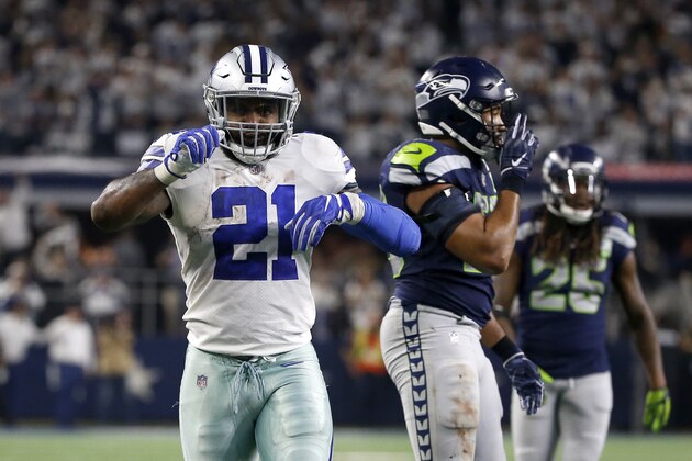 Dallas Cowboys running back Ezekiel Elliott (21) celebrates running the ball for a first down in front of Seattle Seahawks linebacker K.J. Wright (50) during an NFC wild-card NFL football game in Arlington, Texas, Saturday, Jan. 5, 2019.(AP Photo/Ron Jenkins)