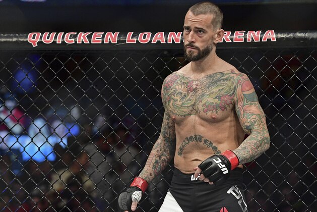 FILE - In this Saturday, Sept. 10, 2016 file photo, CM Punk stands in his corner before a welterweight bout at UFC 203 in Cleveland.  CM Punk won the fight of his life this week when he was cleared by a jury of defamation and invasion of privacy in a lawsuit brought by a wrestling doctor. But he still has a big one ahead when he fights at UFC 225 in Chicago. (AP Photo/David Dermer, File)