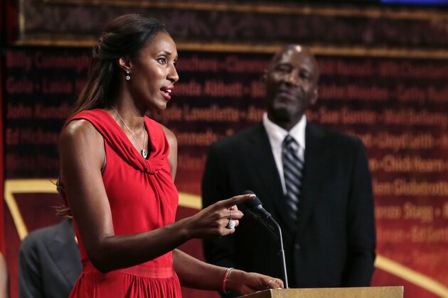 Basketball Hall of Fame inductee Lisa Leslie gestures as Los Angeles Lakers Hall of Famer James Worthy looks on during the enshrinement ceremony for the Class of 2015 of the Naismith Memorial Basketball Hall of Fame in Springfield, Mass., Friday, Sept. 11, 2015. (AP Photo/Charles Krupa)