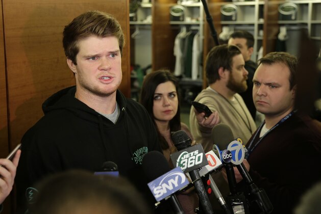 New York Jets quarterback Sam Darnold talks to reporters in the locker room in Florham Park, N.J., Monday, Dec. 31, 2018. The search for a new coach has begun for the New York Jets. After firing Todd Bowles on Sunday night, the team is focused on bringing in someone who will be able to lead a franchise that has missed the playoffs for eight straight seasons but has a promising young quarterback in Darnold and expects to be busy in free agency this offseason.(AP Photo/Seth Wenig)