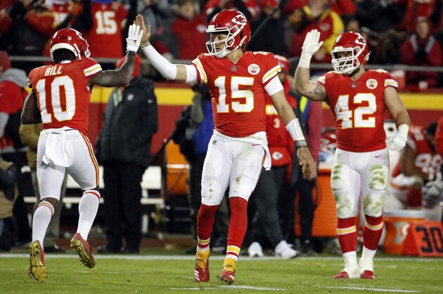 Kansas City Chiefs quarterback Patrick Mahomes (15) celebrates a touchdown by wide receiver Tyreek Hill (10) during the second half of an NFL football game against the Oakland Raiders in Kansas City, Mo., Sunday, Dec. 30, 2018. (AP Photo/Charlie Riedel)