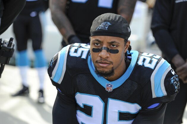 Carolina Panthers strong safety Eric Reid (25) knells along the sideline during the National Anthem before the start of an NFL football game against the Seattle Seahawks in Charlotte, N.C., Sunday, Nov. 25, 2018. (AP Photo/Mike McCarn)