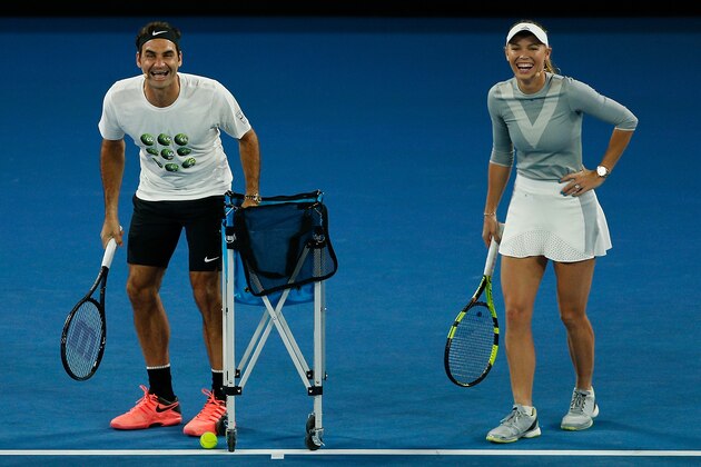 MELBOURNE, AUSTRALIA - JANUARY 13:  Roger Federer and Caroline Wozniacki react at the annual Kids Tennis Day ahead of the 2018 Australian Open at Melbourne Park on January 13, 2018 in Melbourne, Australia.  (Photo by Daniel Pockett/Getty Images)