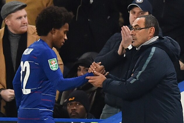 Chelsea's Italian head coach Maurizio Sarri (R) shakes hands with Chelsea's Brazilian midfielder Willian (L) as the Brazilian is substituted during the English League Cup quarter-final football match between Chelsea and Bournemouth at Stamford Bridge in London on December 19, 2018. (Photo by Glyn KIRK / AFP) / RESTRICTED TO EDITORIAL USE. No use with unauthorized audio, video, data, fixture lists, club/league logos or 'live' services. Online in-match use limited to 120 images. An additional 40 images may be used in extra time. No video emulation. Social media in-match use limited to 120 images. An additional 40 images may be used in extra time. No use in betting publications, games or single club/league/player publications. /         (Photo credit should read GLYN KIRK/AFP/Getty Images)