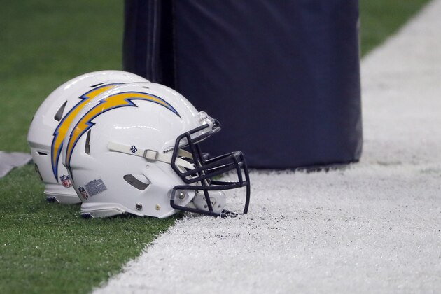 A Los Angeles Chargers helmet sits by and end zone post before an NFL football game against the Dallas Cowboys on Thursday, Nov. 23, 2017, in Arlington, Texas. (AP Photo/Roger Steinman)