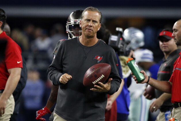 Tampa Bay Buccaneers offensive coordinator and wide receives coach Todd Monken watches warm ups before an NFL football game against the Dallas Cowboys on Sunday, Dec. 18, 2016, in Arlington, Texas. (AP Photo/Michael Ainsworth)