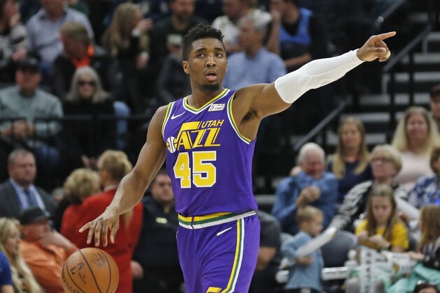 Utah Jazz guard Donovan Mitchell (45) directs his teammates during the second half of an NBA basketball game against the Orlando Magic Wednesday, Jan., 9, 2019, in Salt Lake City. (AP Photo/Rick Bowmer)